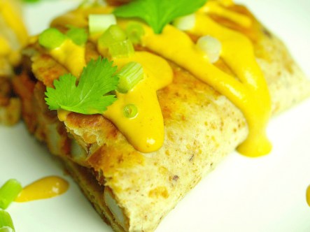 vegan burrito with homemade mexican cheeze sauce